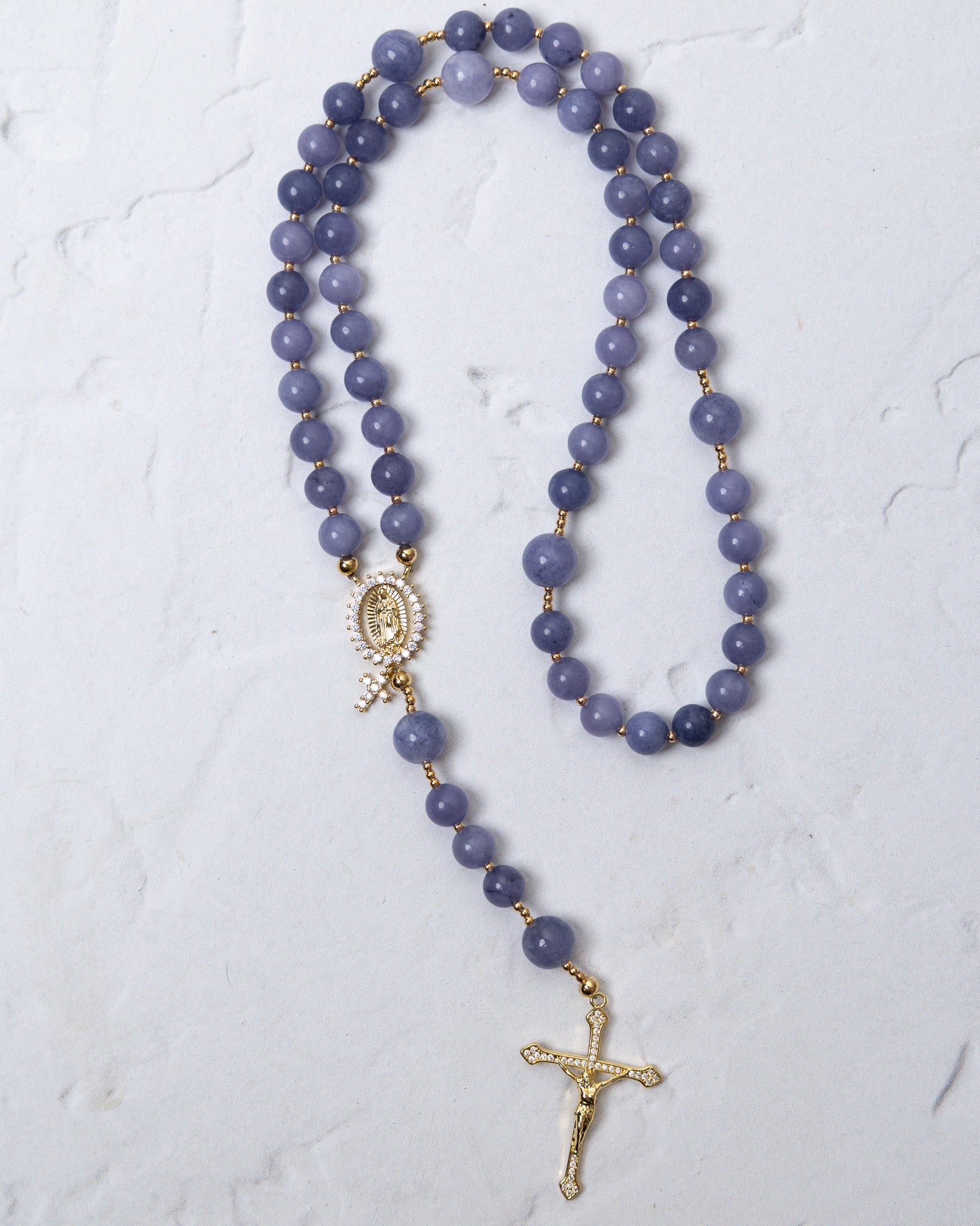 Wisteria bloom rosary featuring a delicate lavender jade bead with gold-toned metal accents and detailed crucifix