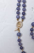 Wisteria bloom rosary with delicate lavender jade beads and gold-toned our lady of guadalupe medallion with clear crystals