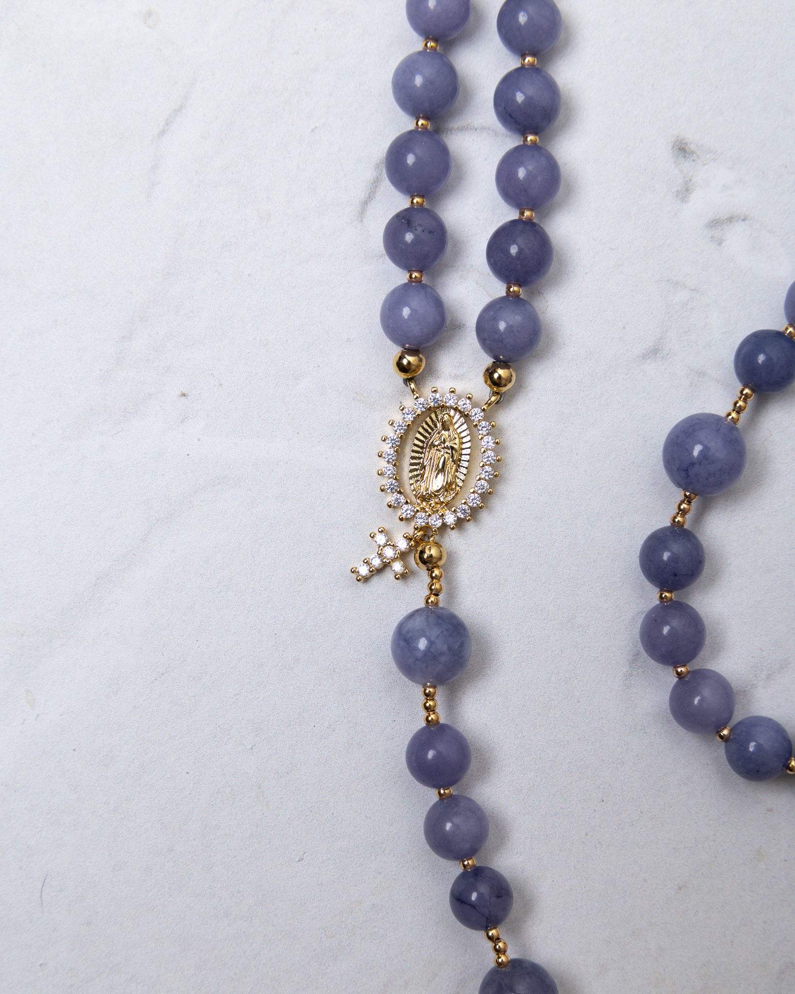 Wisteria bloom rosary with delicate lavender jade beads and gold-toned our lady of guadalupe medallion with clear crystals