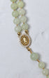 Lily of the valley rosary delicate double-strand necklace with pale green jade beads and gold-toned medallion with stones