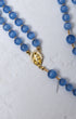 Bluebell rosary with blue translucent beads and a gold-toned our lady of guadalupe medallion