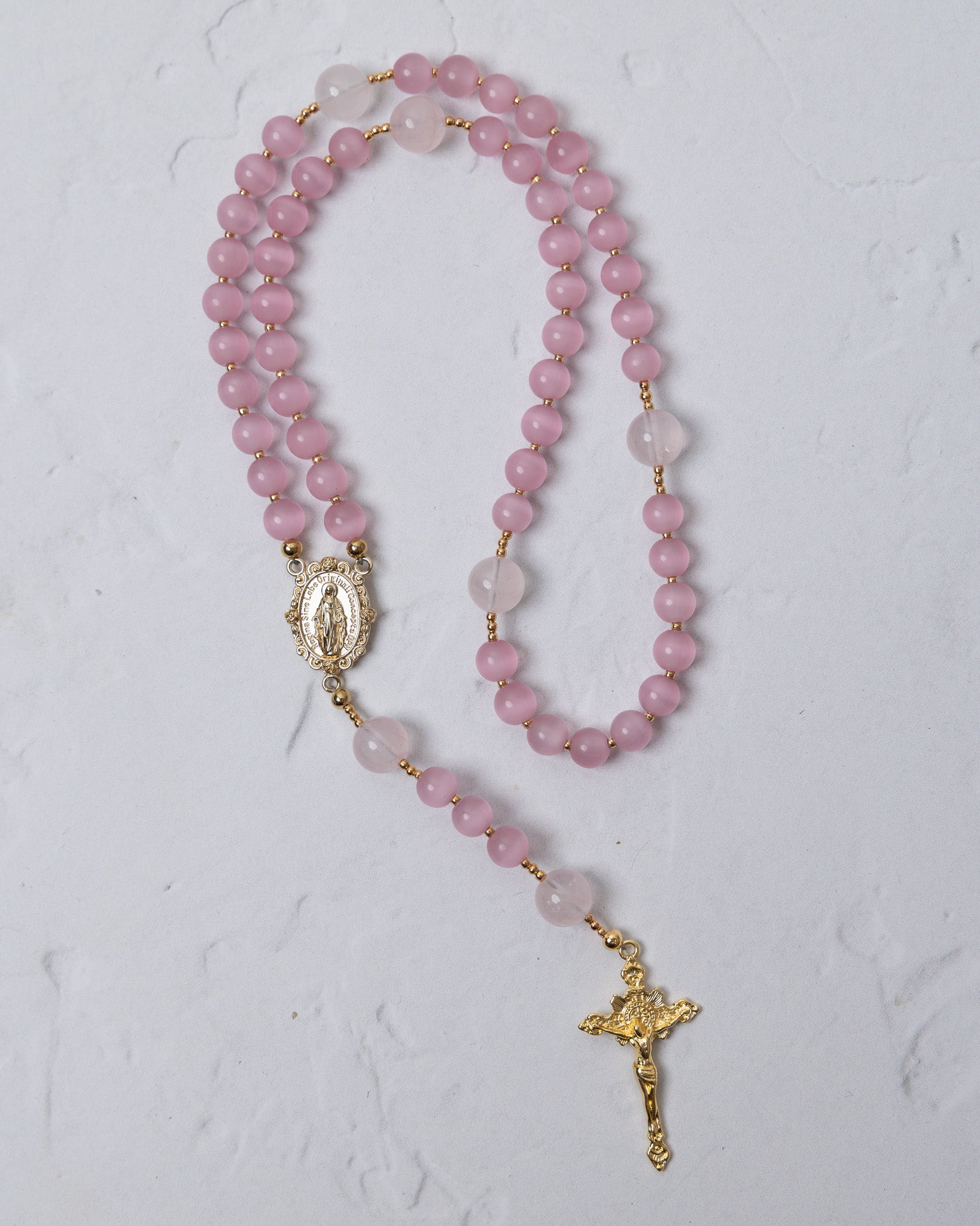 Sweet Pea Rosary delicate pink rose quartz rosary with gold-toned metal accents and detailed crucifix