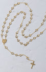 Gold-toned hearts of mary rosary with heart-shaped beads and a cross pendant for prayer and devotion