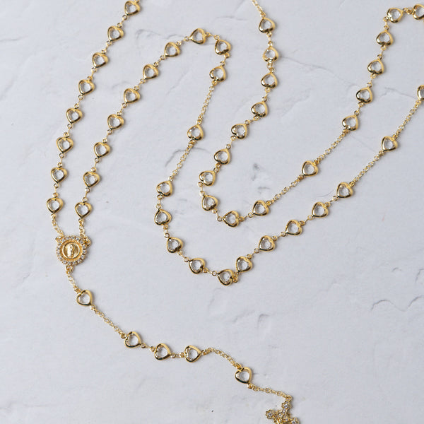 Gold-toned hearts of mary rosary with heart-shaped beads and a cross pendant for prayer and devotion