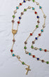 Hearts of Mary rosary gold-toned necklace with colorful heart-shaped beads and an ornate cross pendant on a delicate chain