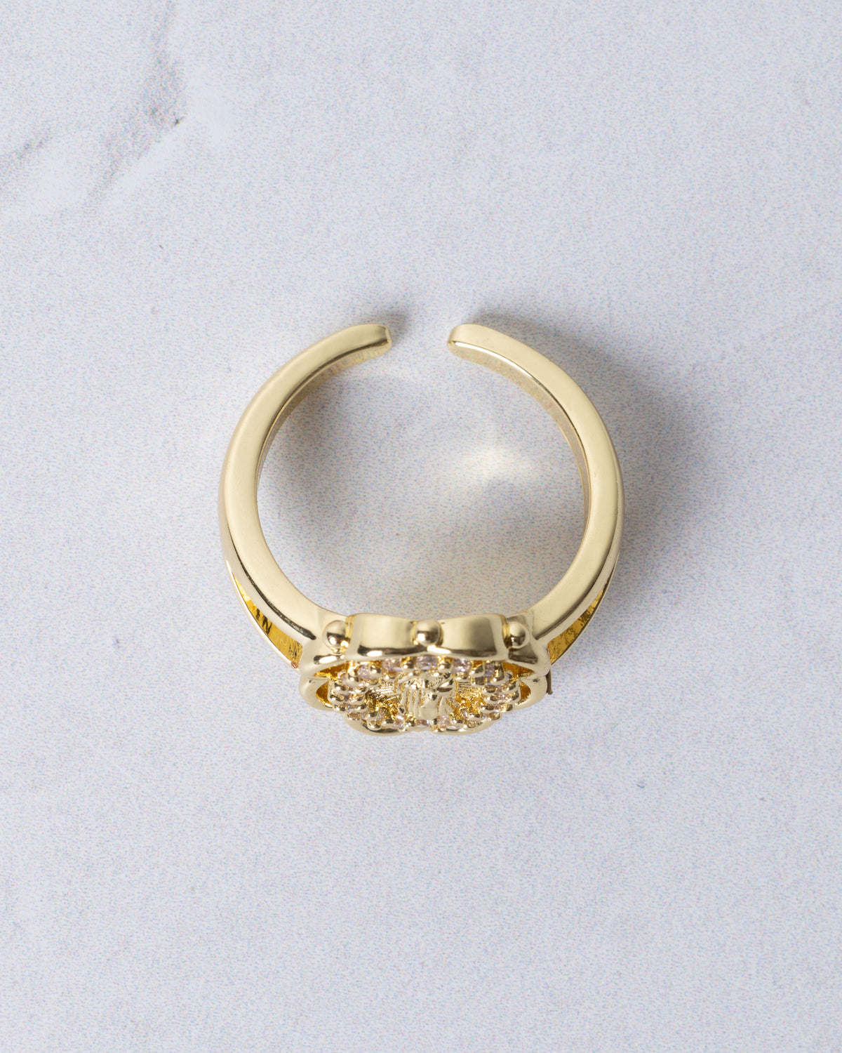 Gold-toned adjustable Marian Halo ring with floral design and clear sparkling stones on band