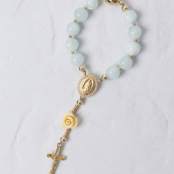 Light blue jade rosary bracelet with gold metal accents virgin mary medallion and ornate cross rose charm car use