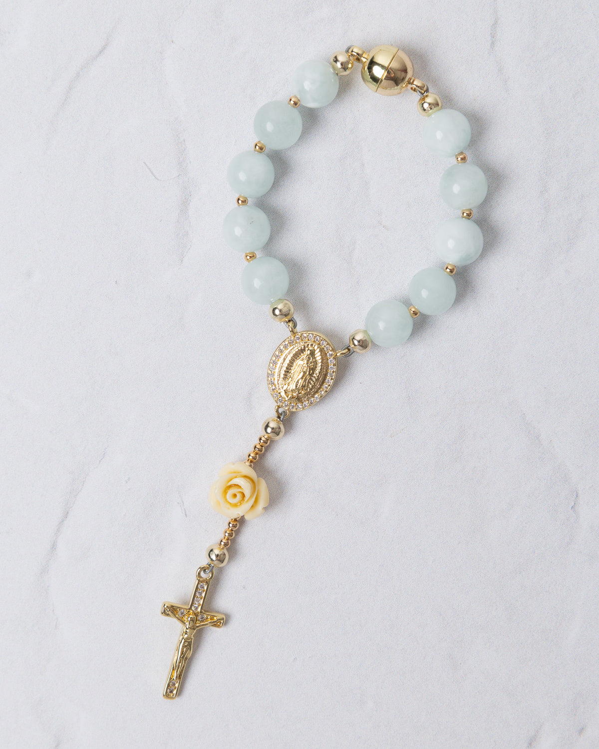 Light blue jade rosary bracelet with gold metal accents virgin mary medallion and ornate cross rose charm car use