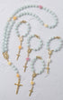 St thereses rose garden rosary featuring a delicate light blue jade chain with gold accents and pink yellow floral beads