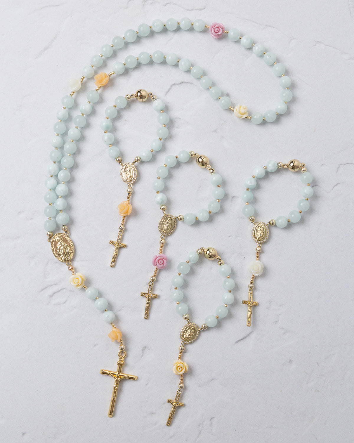 St thereses rose garden rosary featuring a delicate light blue jade chain with gold accents and pink yellow floral beads