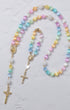 Pastel-colored beaded rainbow covenant rosary with gold-toned metal accents and crucifix for prayer use