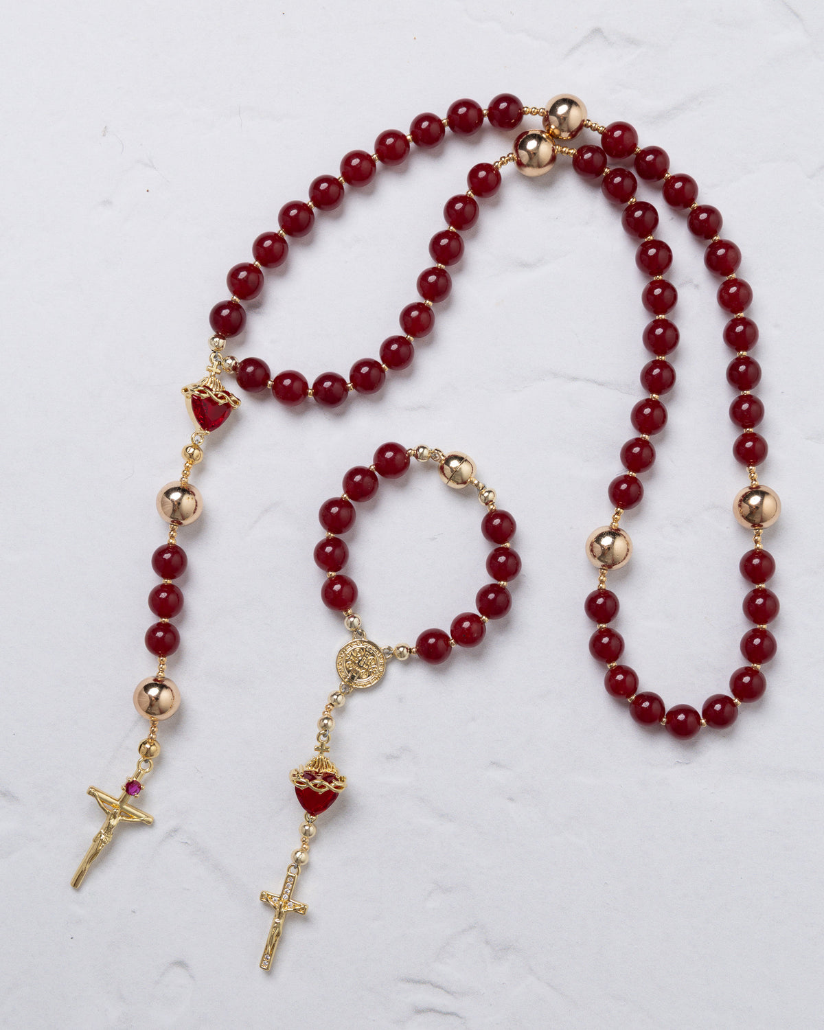 Elegant red agate sacred heart steering wheel rosary set with gold-toned metal accents and heart-shaped centerpiece