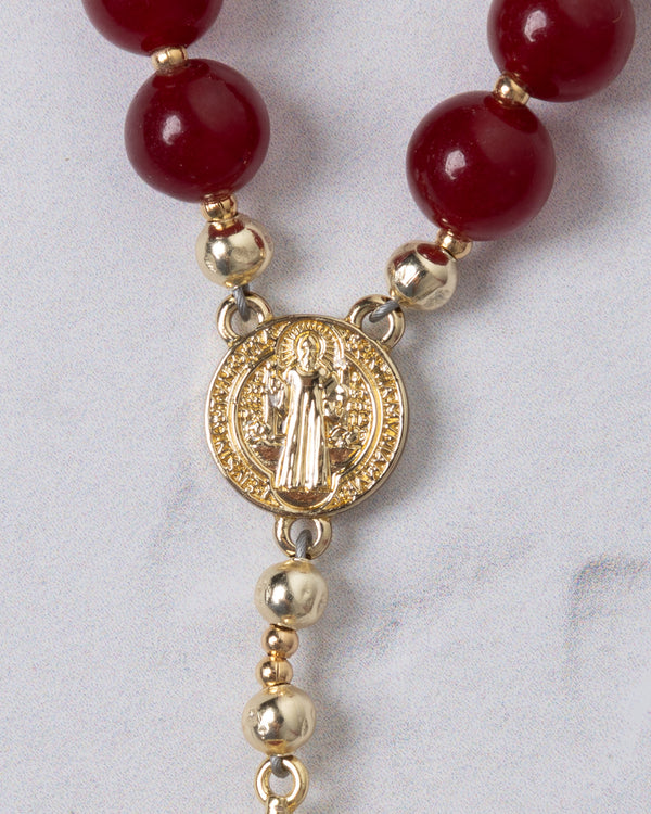 Red agate beads with gold-toned saint benedict medal form a sacred heart steering wheel rosary for prayer use