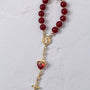 Sacred Heart steering wheel rosary with red agate beads gold-toned metal accents and heart-shaped crystal pendant