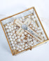 Freshwater pearl wedding lasso rosary in a decorative box with a silver crucifix centerpiece.
