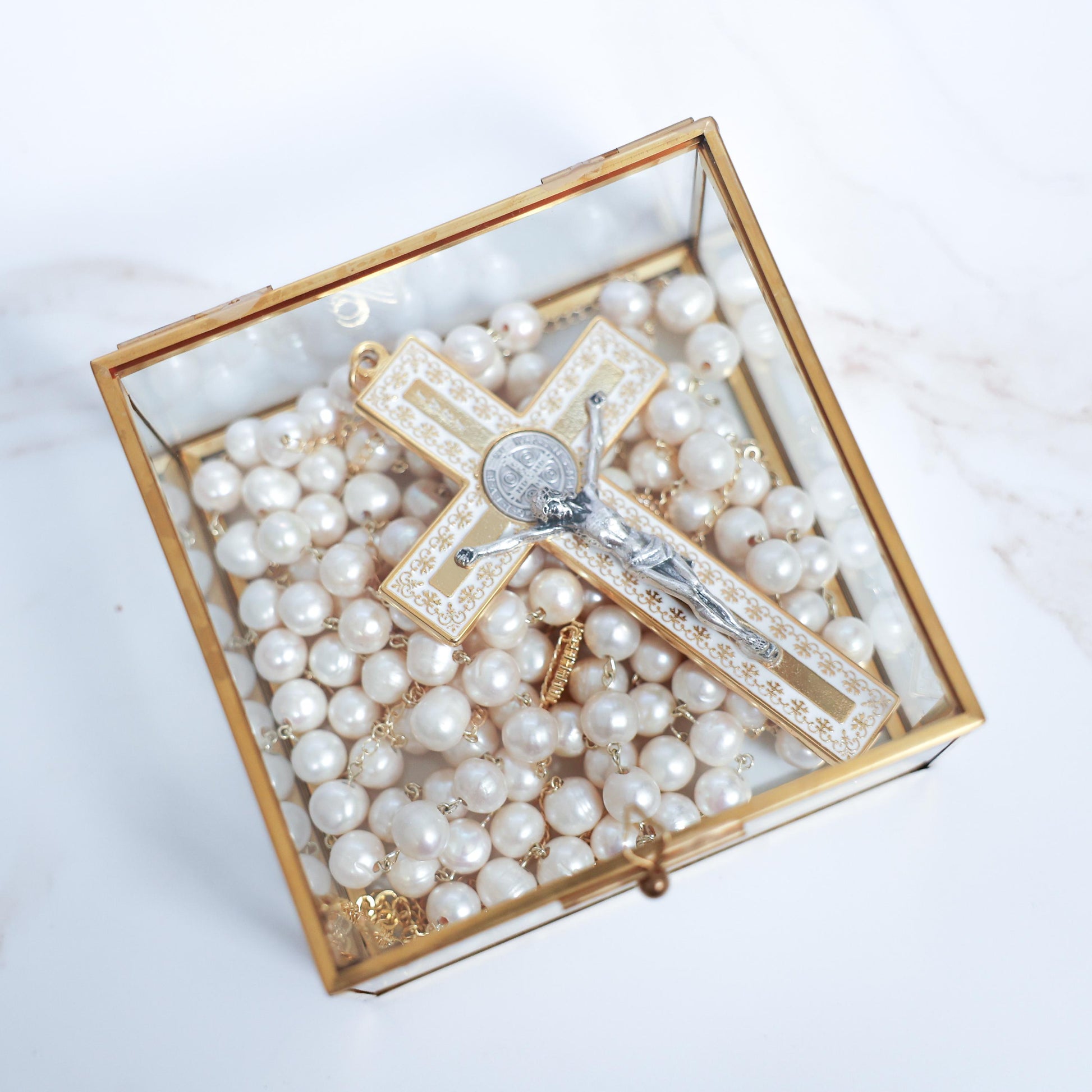 Freshwater pearl wedding lasso rosary in a decorative box with a silver crucifix centerpiece.